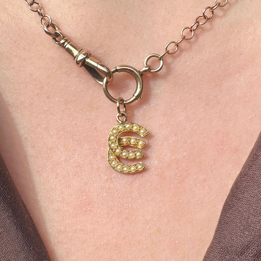 18ct gold pearl double lucky horseshoe charm