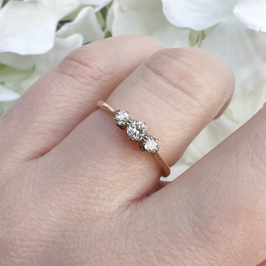 A vintage 18ct gold and platinum diamond trilogy engagement ring.
