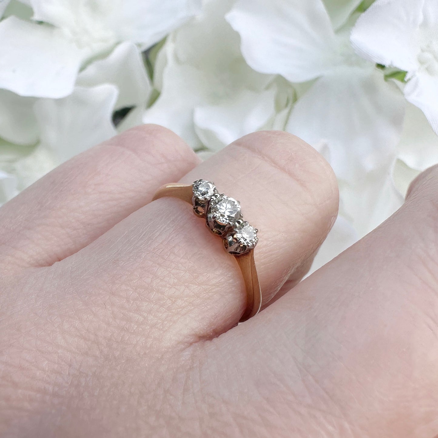 A vintage 18ct gold and platinum diamond trilogy engagement ring.