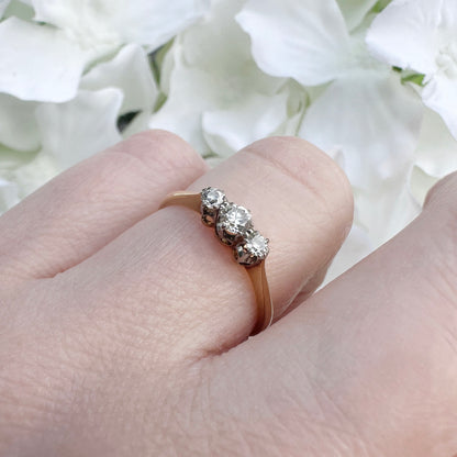 A vintage 18ct gold and platinum diamond trilogy engagement ring.
