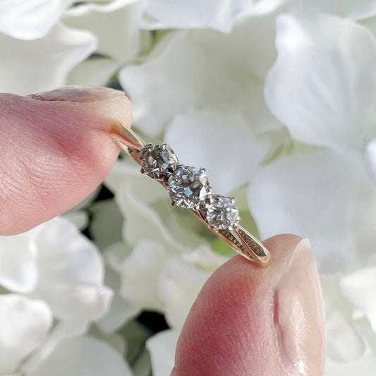 A vintage 18ct gold and platinum diamond trilogy engagement ring.